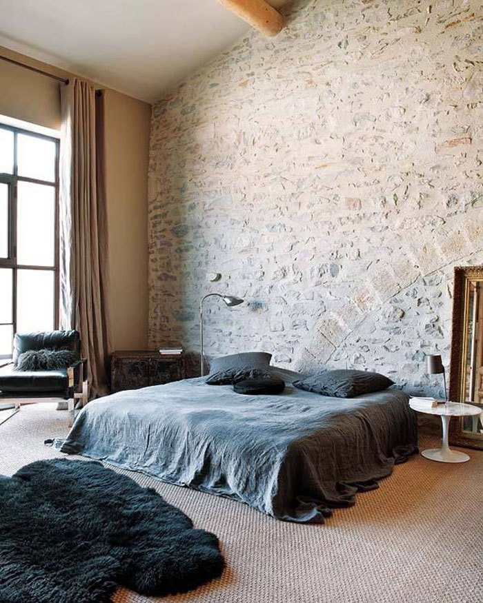 Minimalists Bedroom with Exposed Brick Wall