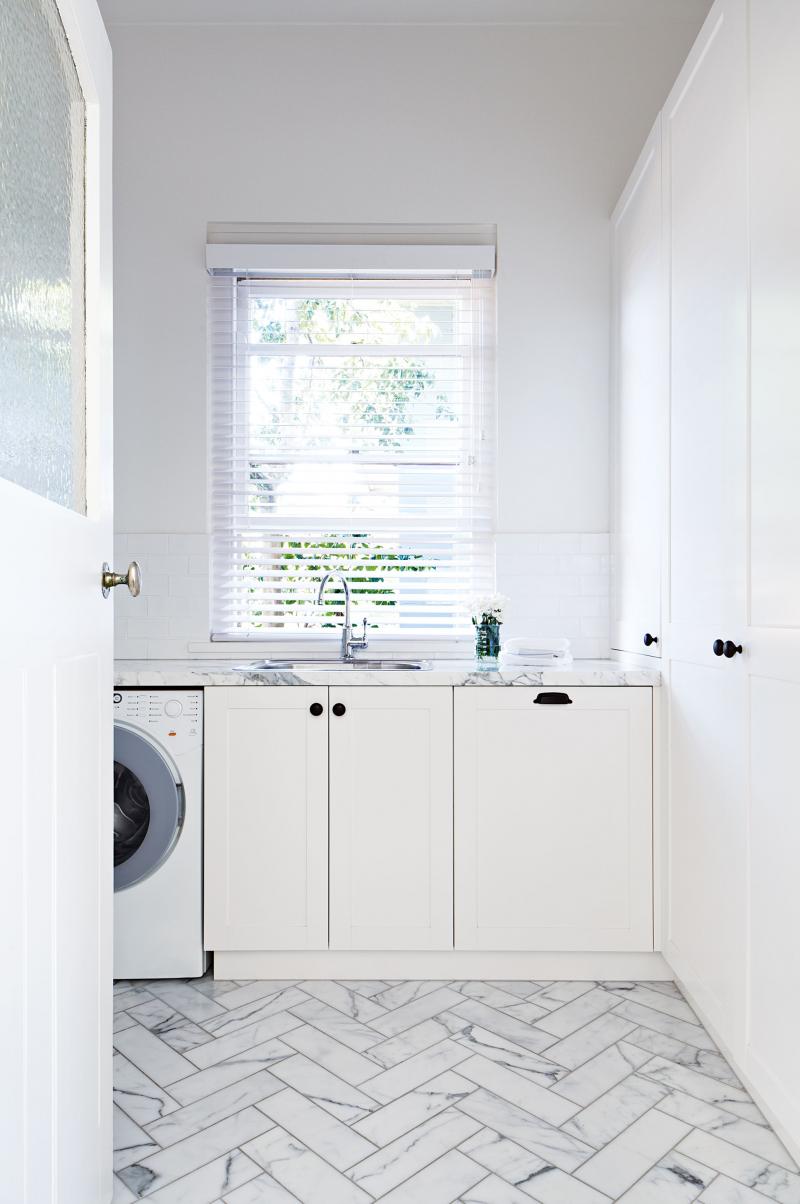 Luxe Laundry Room with Marble Inclusions