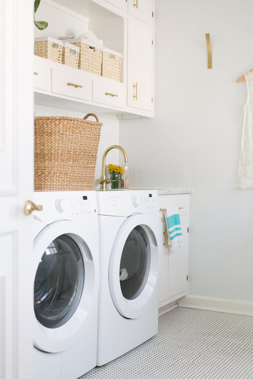 White Laundry Room with Gold Accents