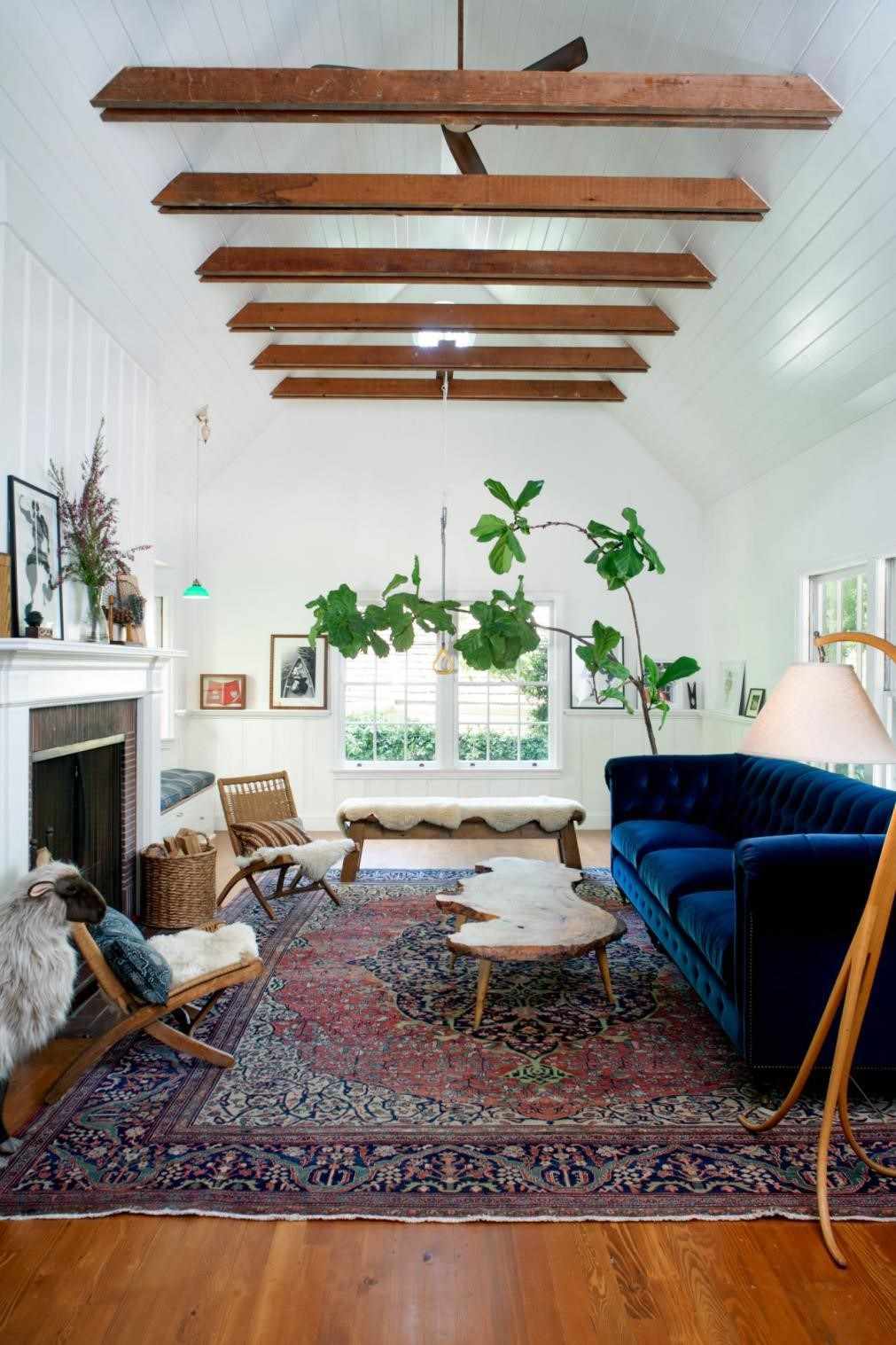 Farmhouse Style Living Room With Blue Velvet Sofa And Area Rug