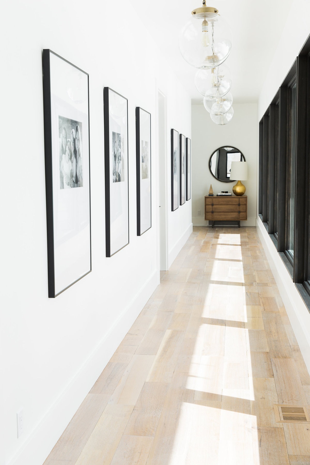 Long Hallway with Gallery and Pendant Lights
