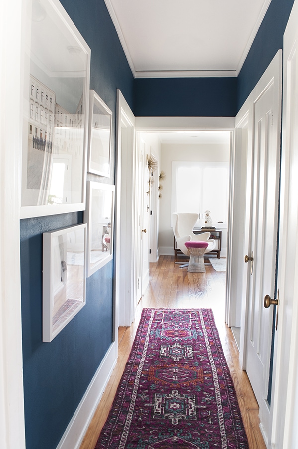 Narrow Hallway with Bold Wall Color