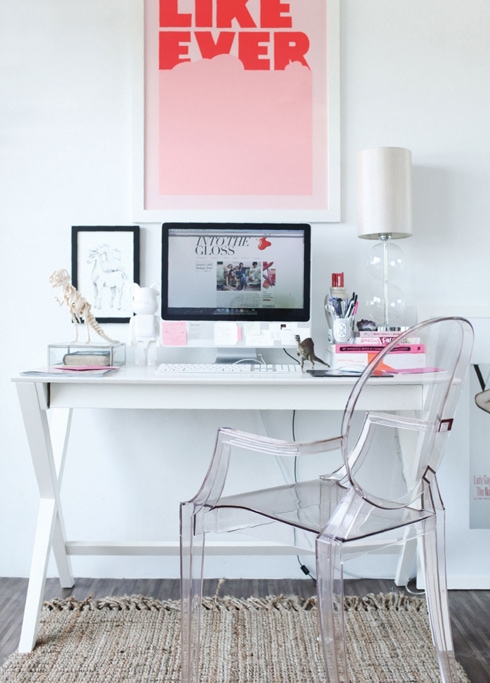 Office Space with Bold, Pink Print & Transparent Chair