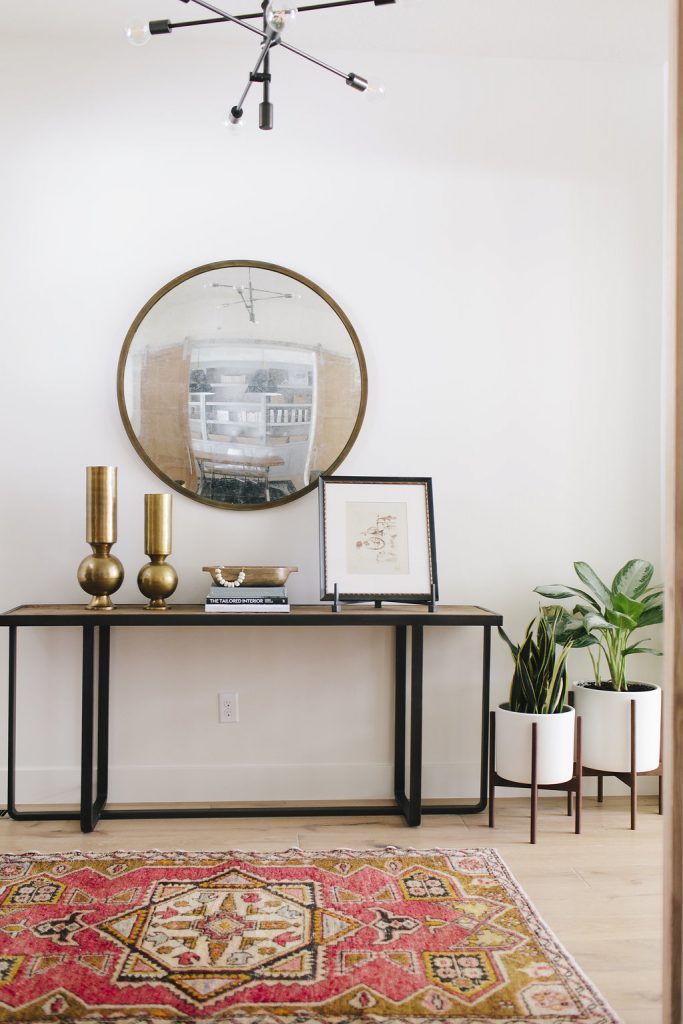 Entryway console table and rounded mirror