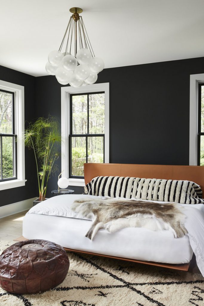 Moroccan-inspired bedroom with black walls