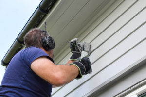 A man painting the walls.