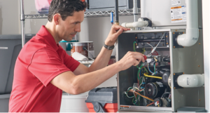 A man doing Furnace Repairs 