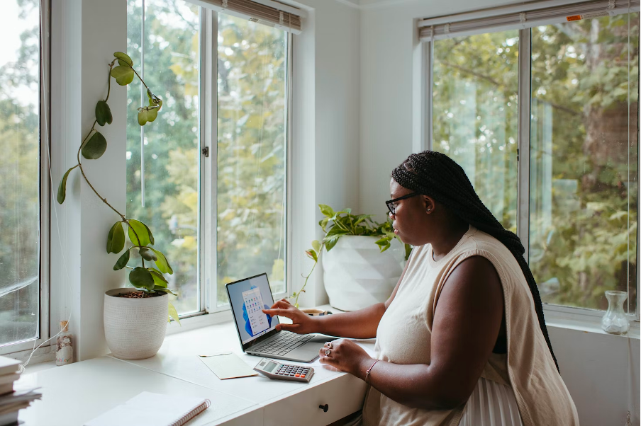 Woman working on laptop.