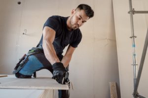 A man cutting ceramic