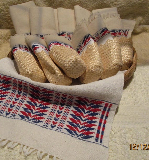 A Low Basket With Linen Napkins